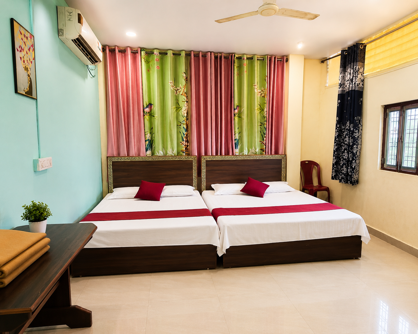 Family Room at Decent Lodge Kamareddy with two double beds